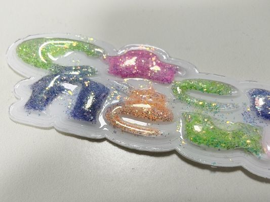 ป้ายกำกับ TPU แบบนุ่มฟูสีชมพู เหลือง แบบกำหนดเองที่ยั่งยืนสำหรับเสื้อผ้า
