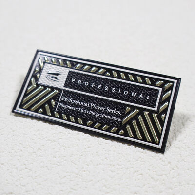 แพทช์ความถี่สูง TPU ที่กําหนดเอง - เหรียญทองโลหะและสีดํา แบจเกมมืออาชีพสําหรับชุดกีฬา